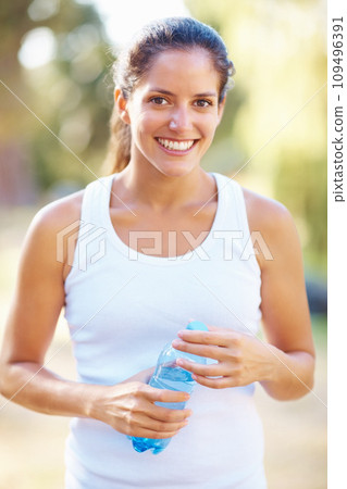 Portrait, fitness or happy woman with water in a park for running, wellness or training with bokeh. Sports, liquid and face of female runner in nature for exercise with positive mindset and energy Portrait, fitness or happy woman with water in a park for running, wellness or training with bokeh. Sports, liquid and face of female runner in nature for exercise with positive mindset and energy 109496391
