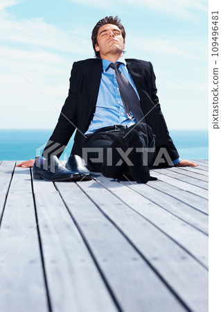 Business man, outdoor and relax on vacation of a corporate professional on holiday with peace on deck. Worker, male employee and suit by sea with calm and blue sky with job and career by ocean Business man, outdoor and relax on vacation of a corporate professional on holiday with peace on deck. Worker, male employee and suit by sea with calm and blue sky with job and career by ocean 109496481