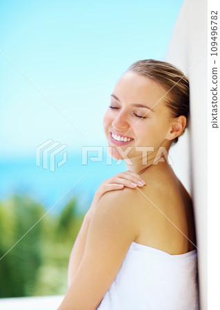 Woman, wall and nature with skincare, health and hands with smile for results by blue sky background. Girl, touch skin and change with cosmetics, wellness and transformation with mockup space outdoor 109496782