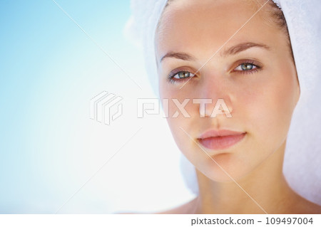 Skincare, beauty and portrait of woman in studio for wellness, cosmetics or treatment on blue background. Mockup, face and calm lady model with dermatology, shine or glowing skin results after shower 109497004