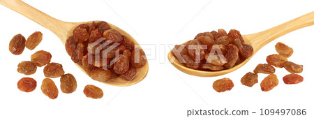 Brown raisins in wooden spoon isolated on white background . Top view. Flat lay 109497086