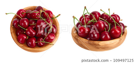 red sweet cherry in wooden bowl isolated on white background with full depth of field, Top view. Flat lay red sweet cherry in wooden bowl isolated on white background with full depth of field, Top view. Flat lay 109497125