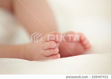Child, newborn and feet or toes closeup or infant development, safety care or growth support. Baby, foot and soft skin asleep for healthy birth on blanket love or tiny legs or wellness, youth in home 109497452