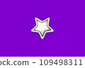 Christmas five pointed golden star on violet background. Christmas decoration. 109498311