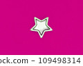 Christmas five pointed golden star on pink background. Christmas decoration. 109498314