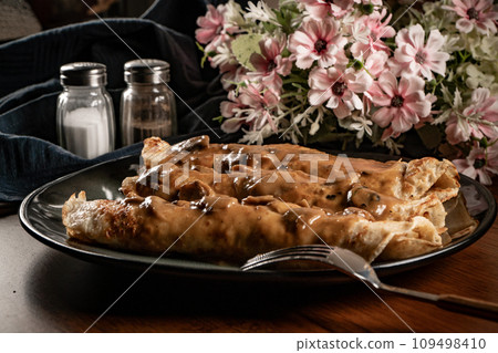 pancakes with mushroom sauce 109498410