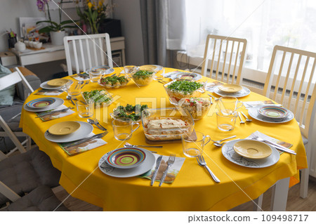 Easter family celebration. Traditional Polish dishes on a wooden table with yellow tablecloth 109498717