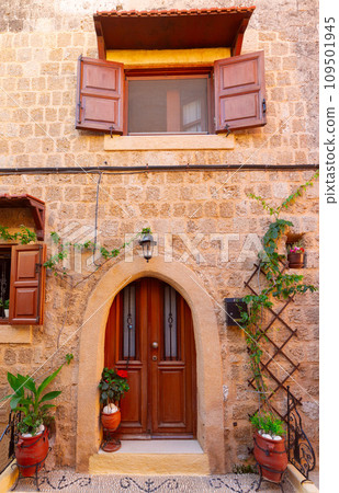 Old medieval street in the historical part of Rhodes. Old medieval street in the historical part of Rhodes. 109501945