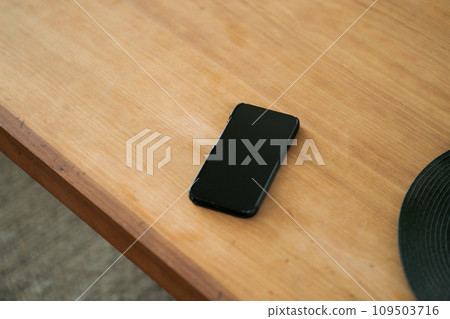 smartphone placed on the desk smartphone placed on the desk 109503716