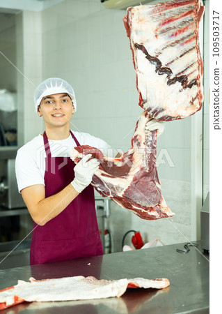 man behind counter prepares man behind counter prepares 109503717