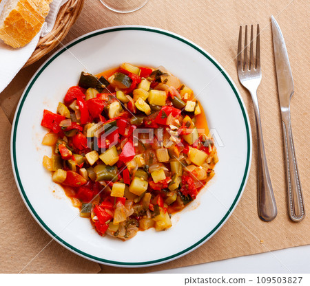 Plate of stewed vegetables on table. Vegetarian dish 109503827