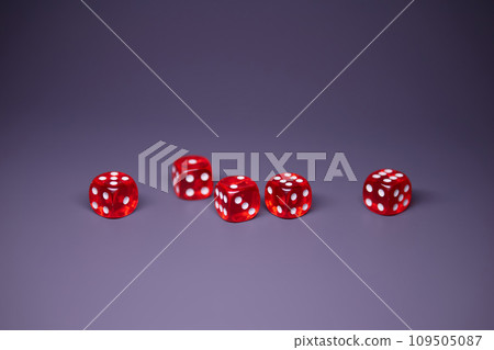 Red dices on grey background. Copy space. 109505087