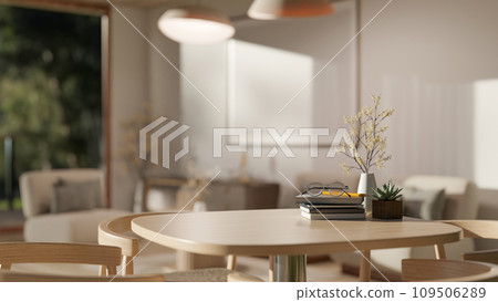 Close-up image of a copy space on a wooden table in a beautiful modern living room. Close-up image of a copy space on a wooden table in a beautiful modern living room. 109506289
