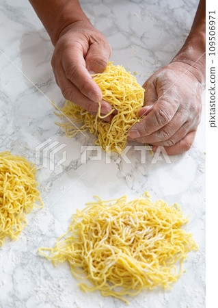 Ramen noodles hand rubbed 109506971