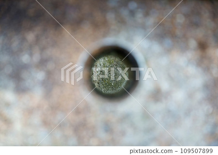 Concrete wall seen through a hole Concrete wall seen through a hole 109507899