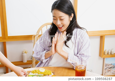 A woman dining at a restaurant A woman dining at a restaurant 109508287