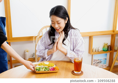 A woman dining at a restaurant A woman dining at a restaurant 109508288