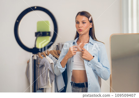 Young woman making fashion video content for social media. Unveiling 109509407