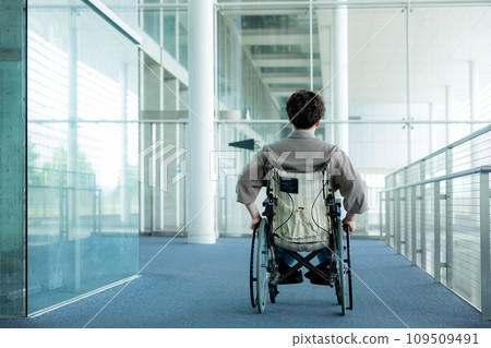 young man in a wheelchair young man in a wheelchair 109509491