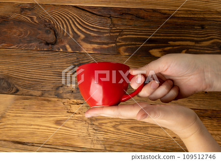 Hand Holds Cup, Empty Red Cup in Hands, Coffee Mug, Teacup, Hot Beverage Mockup Hand Holds Cup, Empty Red Cup in Hands, Coffee Mug, Teacup, Hot Beverage Mockup 109512746