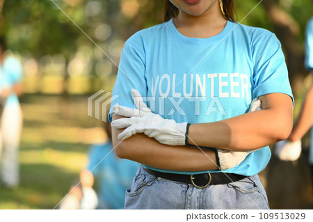 Man in volunteer uniform standing with arms crossed while standing outdoor Man in volunteer uniform standing with arms crossed while standing outdoor 109513029