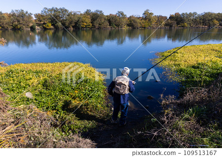 A man enjoying fishing as a hobby in the river 109513167