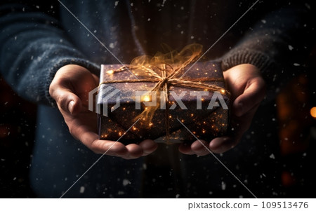 Close up of man hands holding christmas gift box. Mixed media 109513476