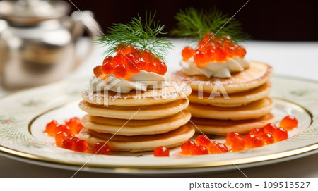 Pancakes with red caviar and butter on a white plate Pancakes with red caviar and butter on a white plate 109513527