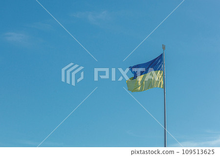 Ukrainian flag against the blue sky 109513625