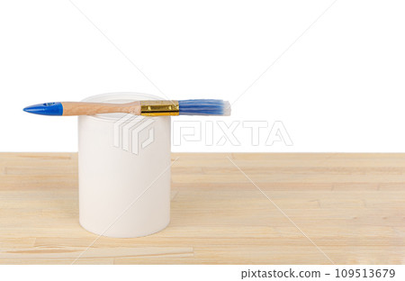 white paint with a brush on a wooden background with texture 109513679