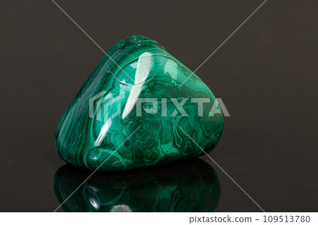 macro mineral stone malachite on a black background 109513780