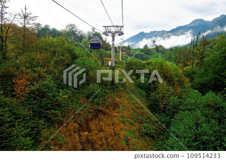 Cable car with cabin in mountains. Funicular. Sightseeing route or excursion for tourists in 109514233