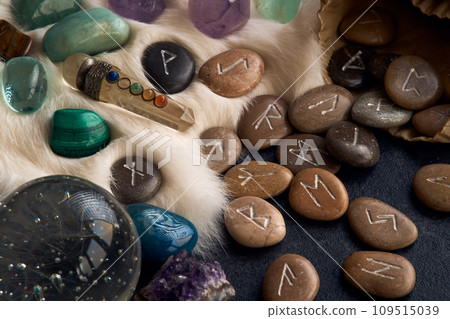 handmade stone runes on white fur 109515039