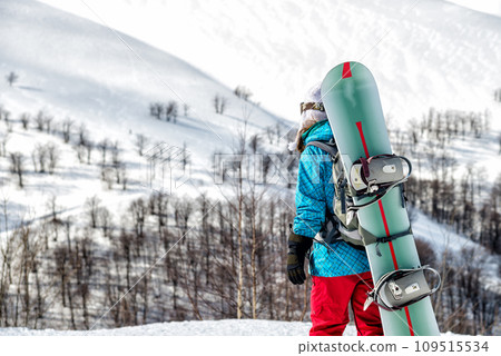 Young woman with the snowboard Young woman with the snowboard 109515534