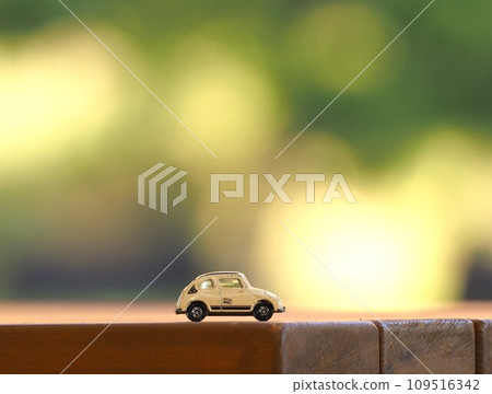 Scenery with miniature cars: Jade blur and Subaru 360 Scenery with miniature cars: Jade blur and Subaru 360 109516342