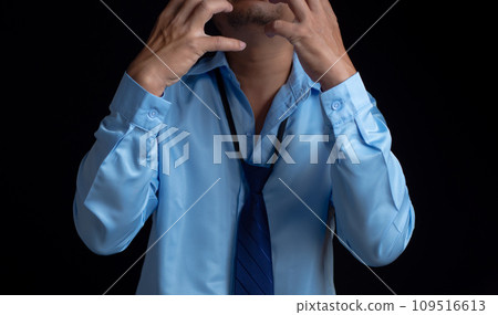 Businessman acted tired headache stressed and anxious from the frustrated business crisis, expresses disappointment, regret, making a mistake. 109516613