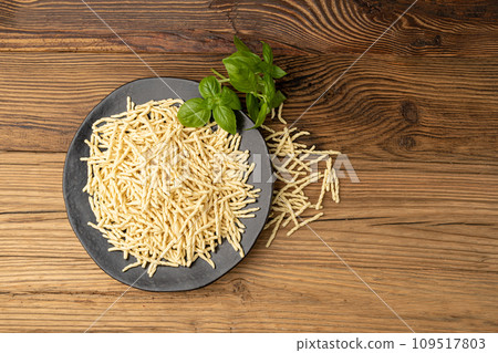 Raw Trofie Pasta, Dry Italian Macaroni, Traditional Genoa Food, Raw Noodle, Modern Ligurian Cuisine Raw Trofie Pasta, Dry Italian Macaroni, Traditional Genoa Food, Raw Noodle, Modern Ligurian Cuisine 109517803