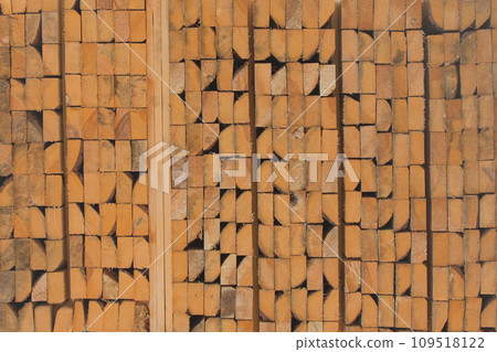 Wood stack texture storage timber wooden materials lumber pile industry stock background 109518122