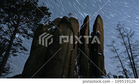 Majestic Rock Formation Silhouetted Against a Starry Night Sky Majestic Rock Formation Silhouetted Against a Starry Night Sky 109519126