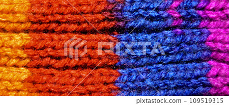 Handmade knitted fabric red blue and orange wool background texture 109519315