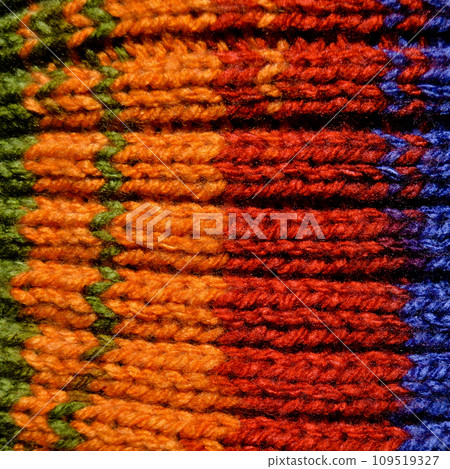 Handmade knitted fabric red blue and orange wool background texture 109519327