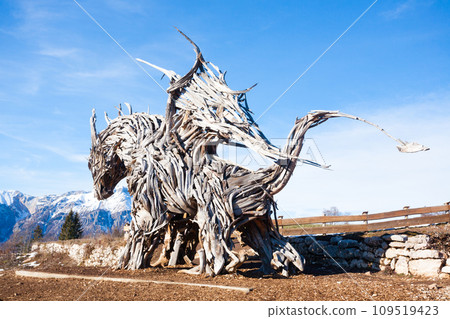 Wooden sculpture of a dragon. Italian landmark 109519423