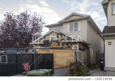 Calgary, Alberta, Canada. Oct 10, 2023. A neighborhood garage roof, which bears the scars of recent accidental fire damage, expertly extinguished by firefighters. Calgary, Alberta, Canada. Oct 10, 2023. A neighborhood garage roof, which bears the scars of recent accidental fire damage, expertly extinguished by firefighters. 109519956