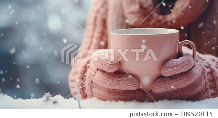 AI-generated content. Close-up of female hands in pink wool gloves holding a cup of hot cocoa on a snowy. Generative AI  109520115