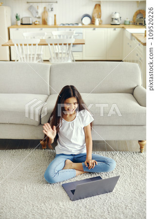 Pre-teen girl using laptop start videocall talk to friend 109520226