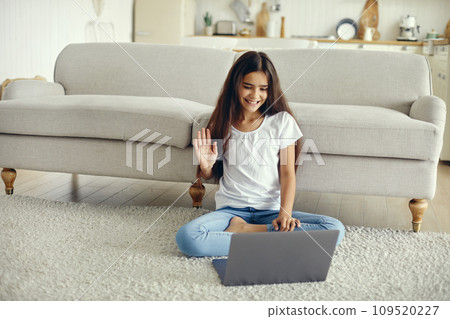 Pre-teen girl using laptop start videocall talk to friend 109520227
