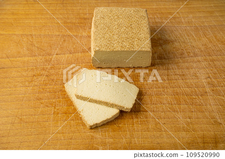 Tofu Cheese Isolated, Smoked Vegan Cheese Slice, Sliced Soya Bean Curd, Soy Protein or TSP Tofu Cheese Isolated, Smoked Vegan Cheese Slice, Sliced Soya Bean Curd, Soy Protein or TSP 109520990