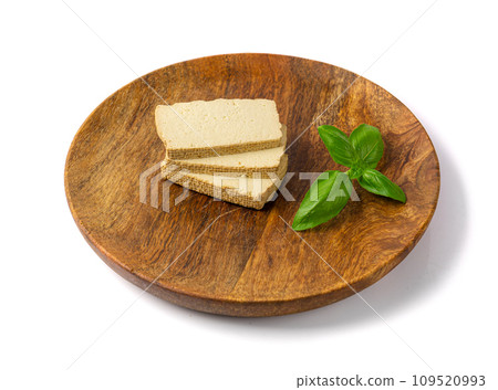 Tofu Cheese Isolated, Smoked Vegan Cheese Slice, Sliced Soya Bean Curd, Soy Protein or TSP Tofu Cheese Isolated, Smoked Vegan Cheese Slice, Sliced Soya Bean Curd, Soy Protein or TSP 109520993