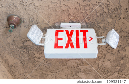 red exit sign on the sand celling  109521147