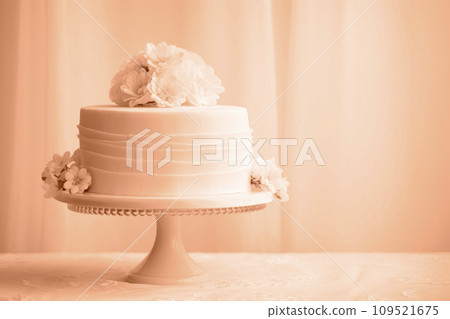 AI-generated content. A beautiful peach-colored birthday cake on a background with a place to copy.  109521675